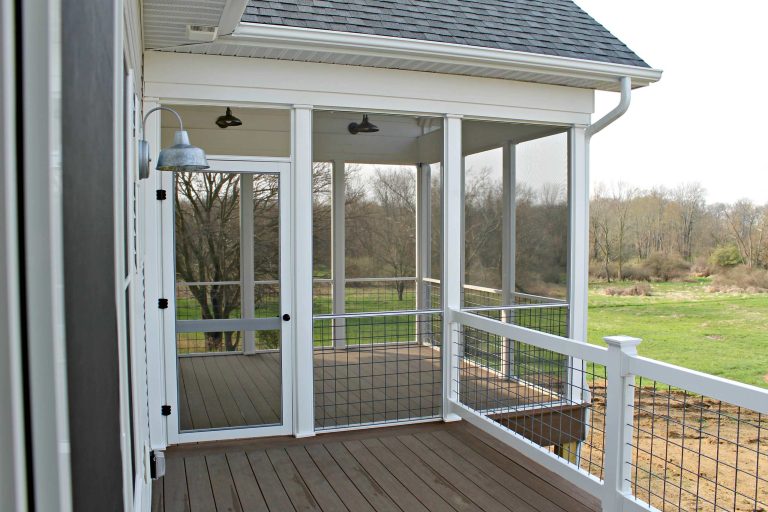 Mid-sized farmhouse screened-in back porch idea in Other with decking and a roof extension by Clutter Funk | Outdoor Photos | Porch | Landscaping | Landscape Design | Outdoor Living Space | Porch Design Ideas | Outdoor Living Space Ideas | Backyard Design