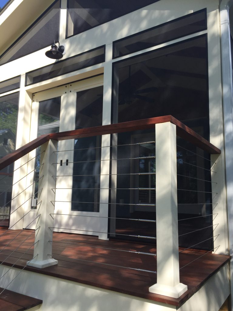 Mid-sized farmhouse screened-in back porch photo in Other with decking and a roof extension by Integrity Design + Build | Outdoor Photos | Porch | Landscaping | Landscape Design | Outdoor Living Space | Porch Design Ideas | Outdoor Living Space Ideas | Backyard Design
