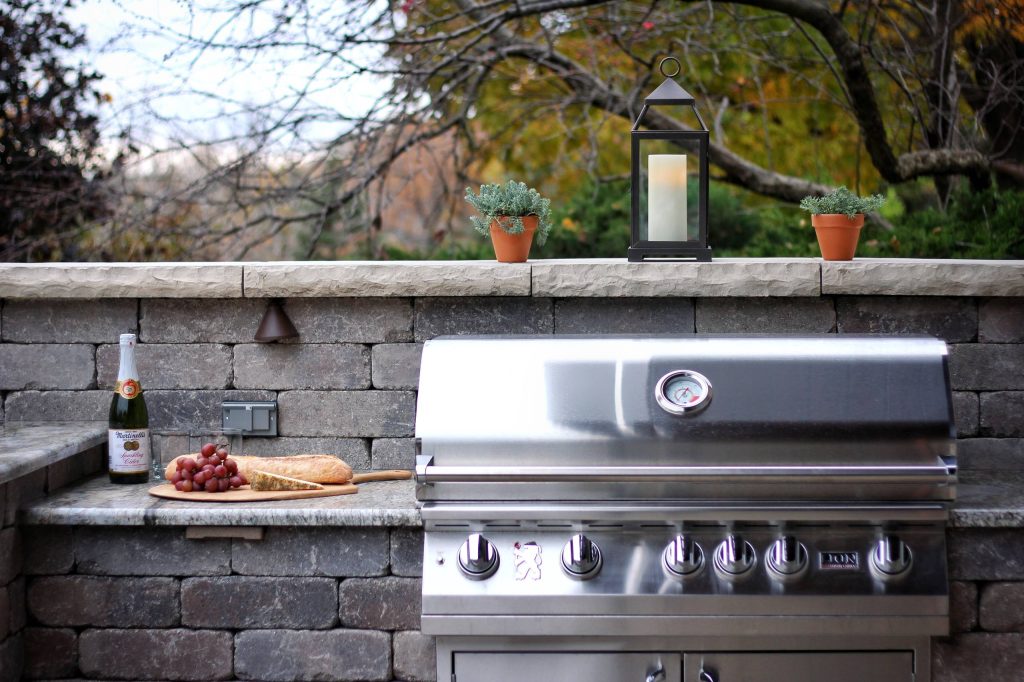 Mid-sized mid-century modern backyard concrete paver patio kitchen photo in Other