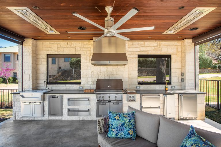 Mid-sized minimalist backyard concrete patio kitchen photo in Dallas with a gazebo