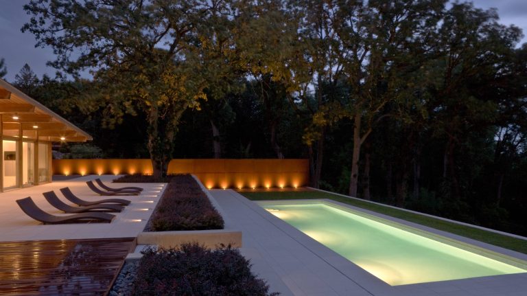 Mid-sized minimalist backyard concrete paver and rectangular lap pool photo in Minneapolis