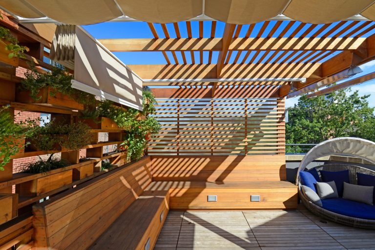Mid-sized minimalist backyard patio kitchen photo in DC Metro with decking and a pergola
