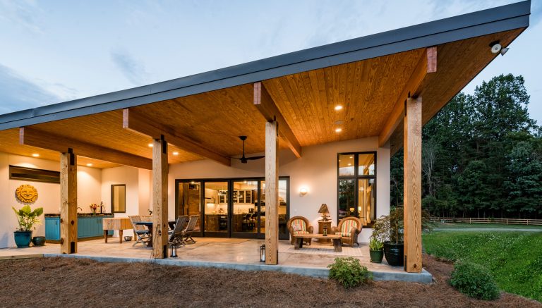 Mid-sized minimalist backyard patio kitchen photo in Other with a roof extension