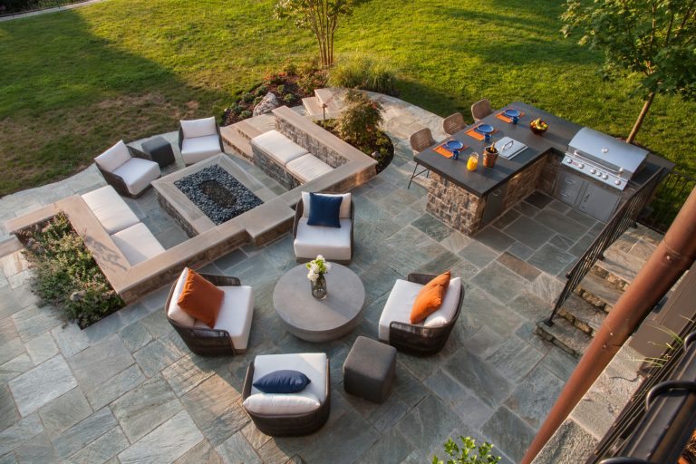 Mid-sized minimalist backyard stamped concrete patio kitchen photo in DC Metro with no cover