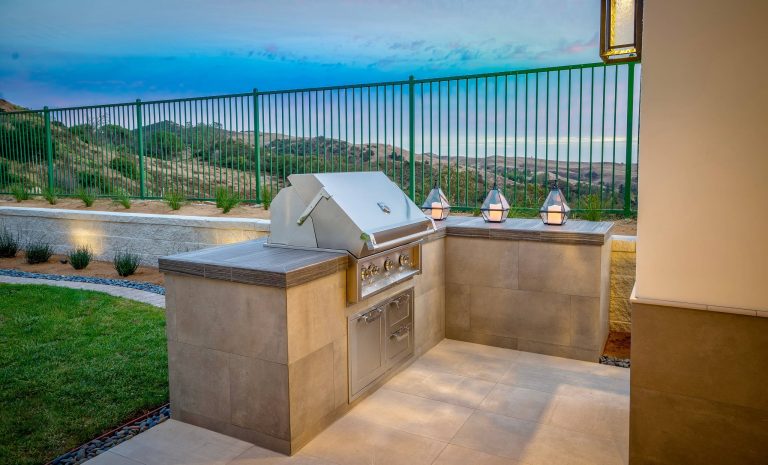 Mid-sized minimalist backyard tile patio kitchen photo in Orange County