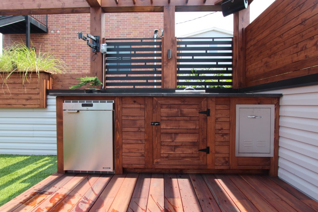 Mid-sized minimalist rooftop outdoor kitchen deck photo in Chicago with a pergola