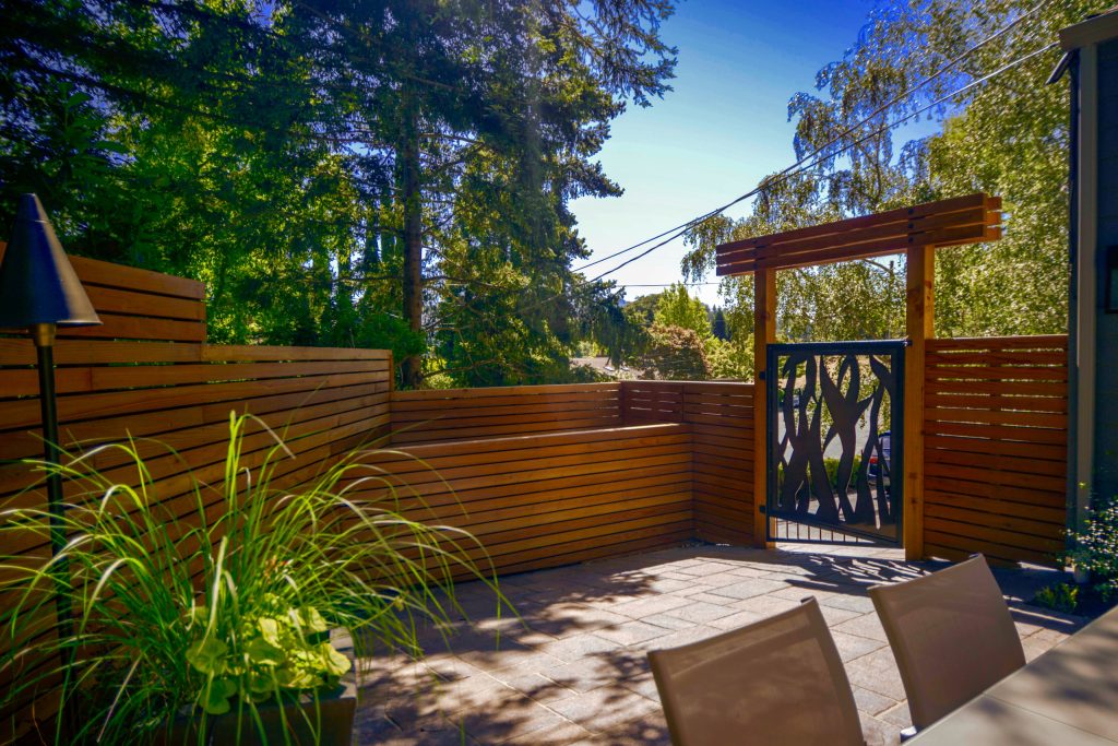 Mid-sized minimalist side yard concrete paver patio kitchen photo in San Francisco with no cover