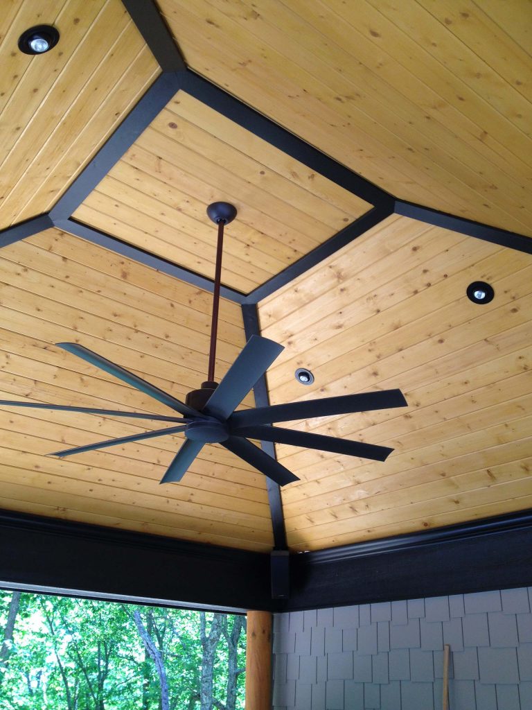 Mid-sized mountain style backyard stamped concrete patio kitchen photo in Other with a gazebo