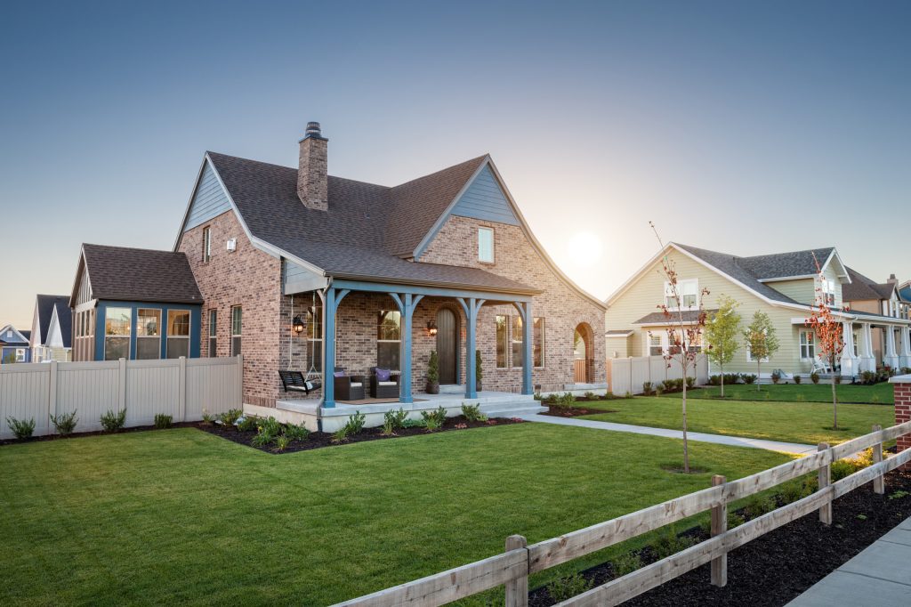 Mid-sized mountain style front porch idea in Salt Lake City with a roof extension by Destination Homes | Outdoor Photos | Porch | Landscaping | Landscape Design | Outdoor Living Space | Porch Design Ideas | Outdoor Living Space Ideas | Backyard Design