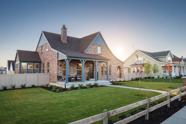 Mid-sized mountain style front porch idea in Salt Lake City with a roof extension by Destination Homes | Outdoor Photos | Porch | Landscaping | Landscape Design | Outdoor Living Space | Porch Design Ideas | Outdoor Living Space Ideas | Backyard Design