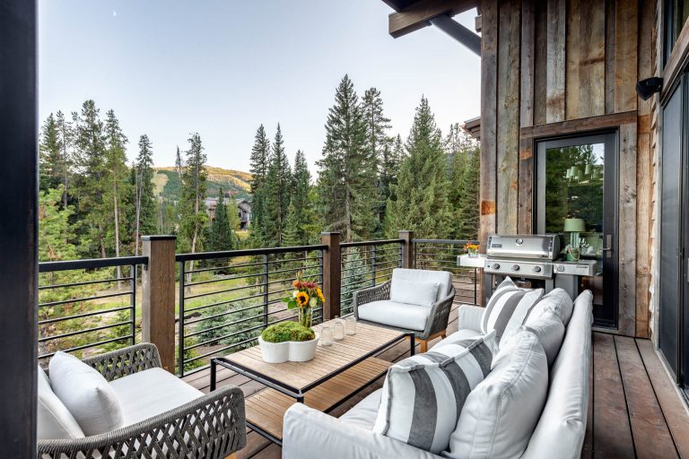 Mid-sized mountain style mixed material railing deck photo in Other