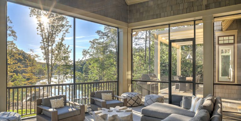 Mid-sized mountain style screened-in back porch idea in Charlotte with a roof extension by Ashley J. Design | Outdoor Photos | Porch | Landscaping | Landscape Design | Outdoor Living Space | Porch Design Ideas | Outdoor Living Space Ideas | Backyard Design