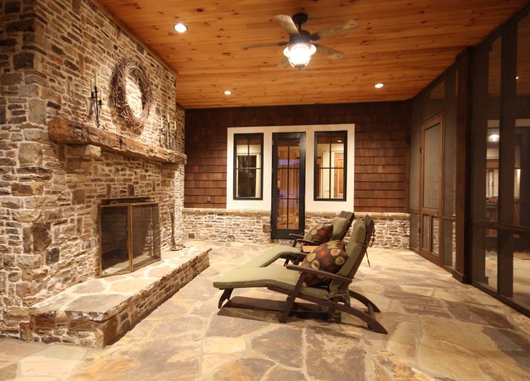Mid-sized mountain style stone back porch idea in Atlanta with a fire pit and a roof extension by Timberlake Custom Homes | Outdoor Photos | Porch | Landscaping | Landscape Design | Outdoor Living Space | Porch Design Ideas | Outdoor Living Space Ideas | Backyard Design