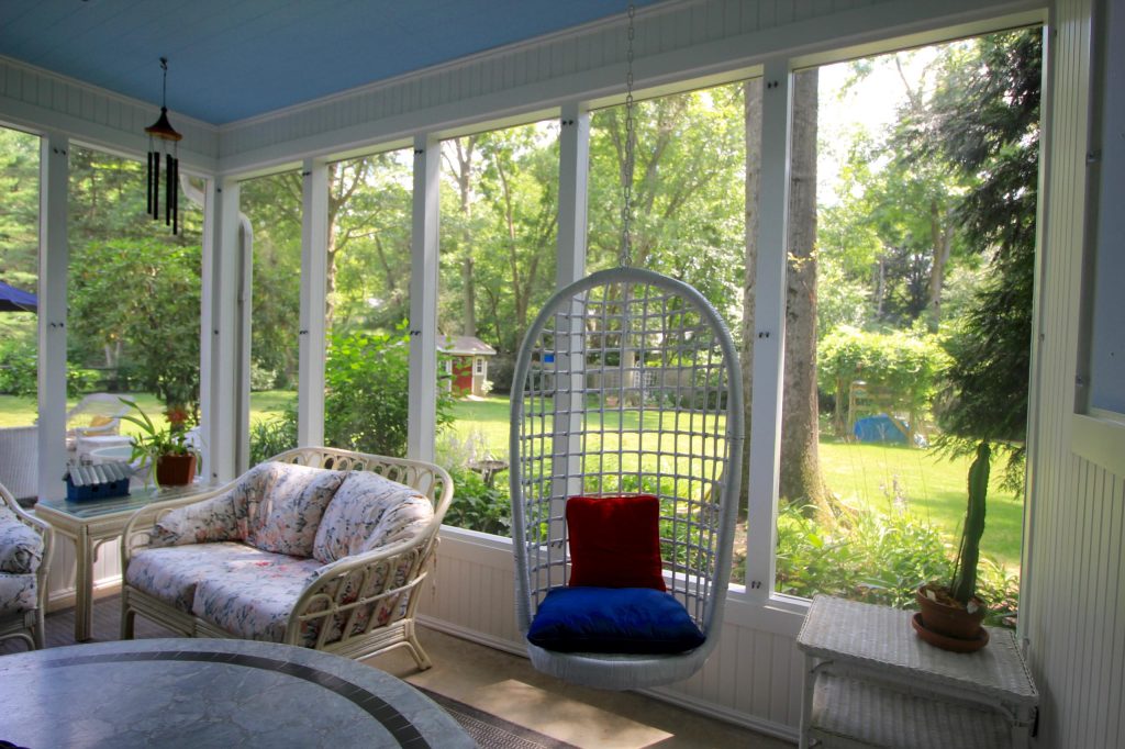 Mid-sized screened-in back porch photo in Philadelphia with a roof extension by Lawrenceville Home Improvement Center, Inc. | Outdoor Photos | Porch | Landscaping | Landscape Design | Outdoor Living Space | Porch Design Ideas | Outdoor Living Space Ideas | Backyard Design