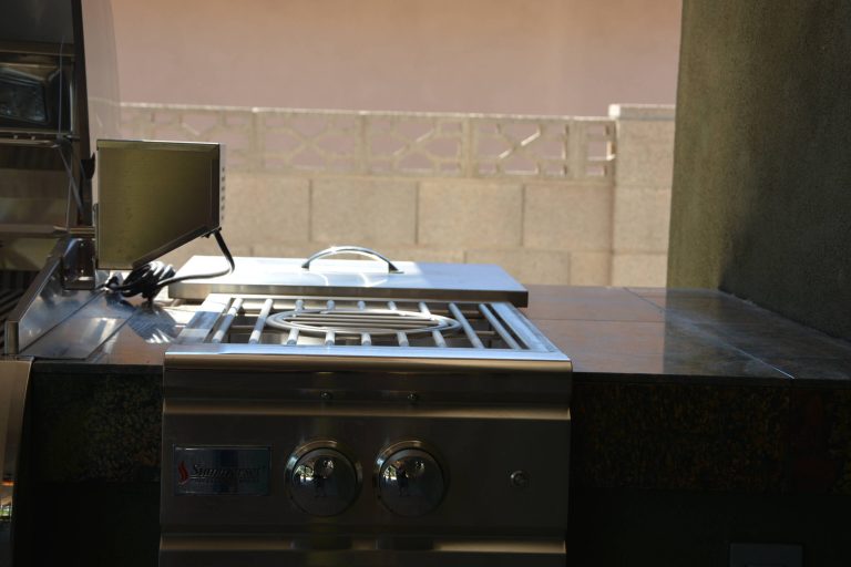 Mid-sized southwest backyard concrete paver patio kitchen photo in Phoenix