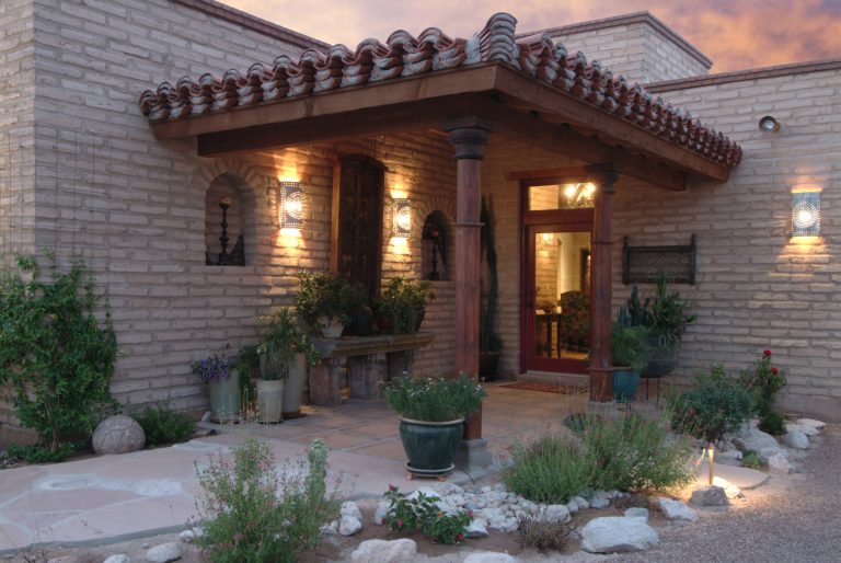 Mid-sized southwest tile front porch photo in Phoenix with a roof extension by Stellar Gray Fine Homes | Outdoor Photos | Porch | Landscaping | Landscape Design | Outdoor Living Space | Porch Design Ideas | Outdoor Living Space Ideas | Backyard Design