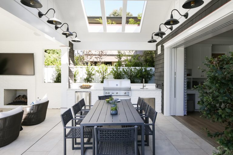 Mid-sized transitional backyard concrete patio kitchen photo in Orange County with a roof extension