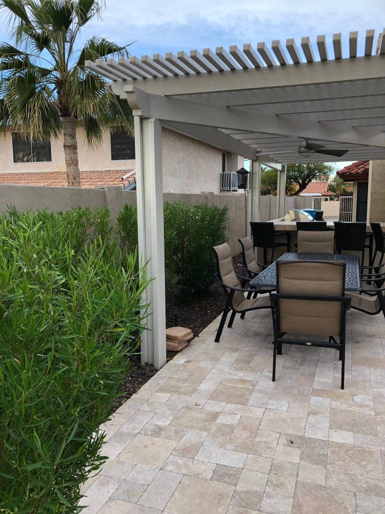 Mid-sized transitional backyard concrete paver patio kitchen photo in Phoenix with a pergola
