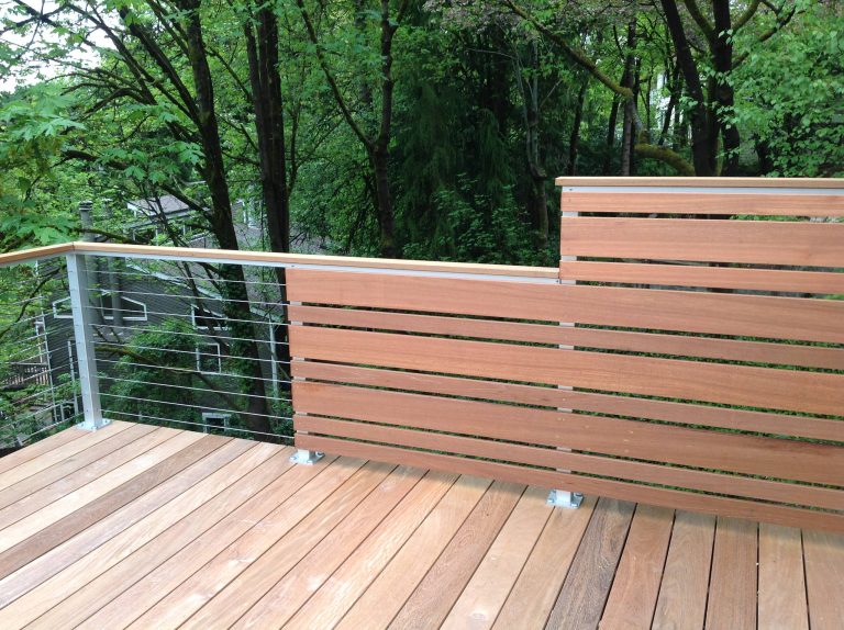 Mid-sized transitional backyard deck photo in Portland with no cover
