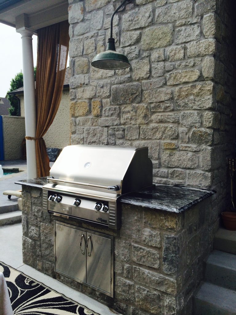 Mid-sized transitional backyard patio kitchen photo in Other with no cover