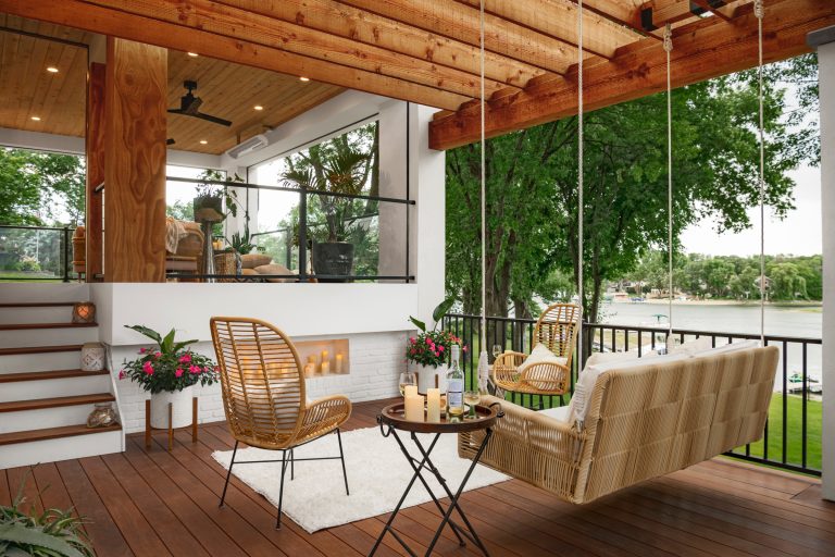 Mid-sized transitional backyard second story privacy and mixed material railing deck photo in Minneapolis with a pergola
