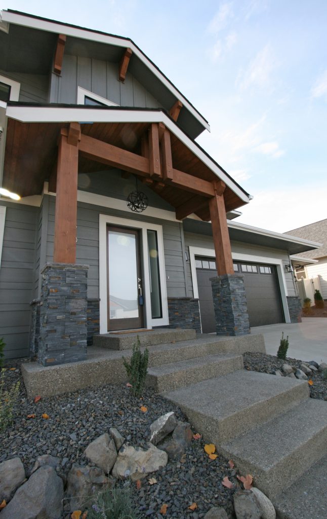 Mid-sized transitional concrete front porch idea in Seattle with a roof extension by Taylor Design | Outdoor Photos | Porch | Landscaping | Landscape Design | Outdoor Living Space | Porch Design Ideas | Outdoor Living Space Ideas | Backyard Design
