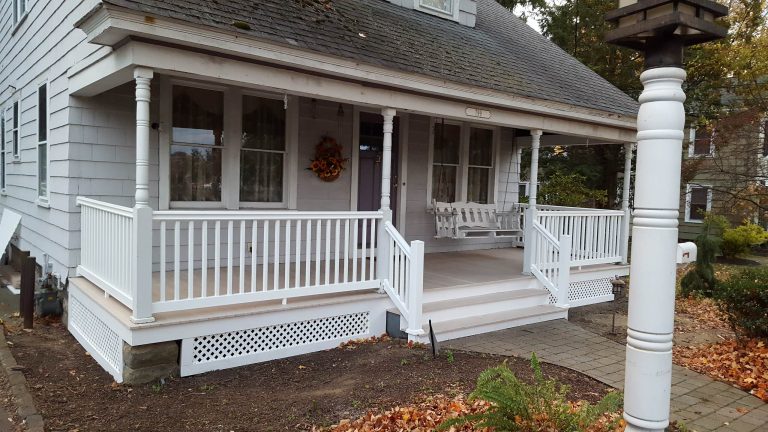 Mid-sized transitional concrete paver front porch photo in Boston with a roof extension by LD's Unlimited Home Improvement | Outdoor Photos | Porch | Landscaping | Landscape Design | Outdoor Living Space | Porch Design Ideas | Outdoor Living Space Ideas | Backyard Design
