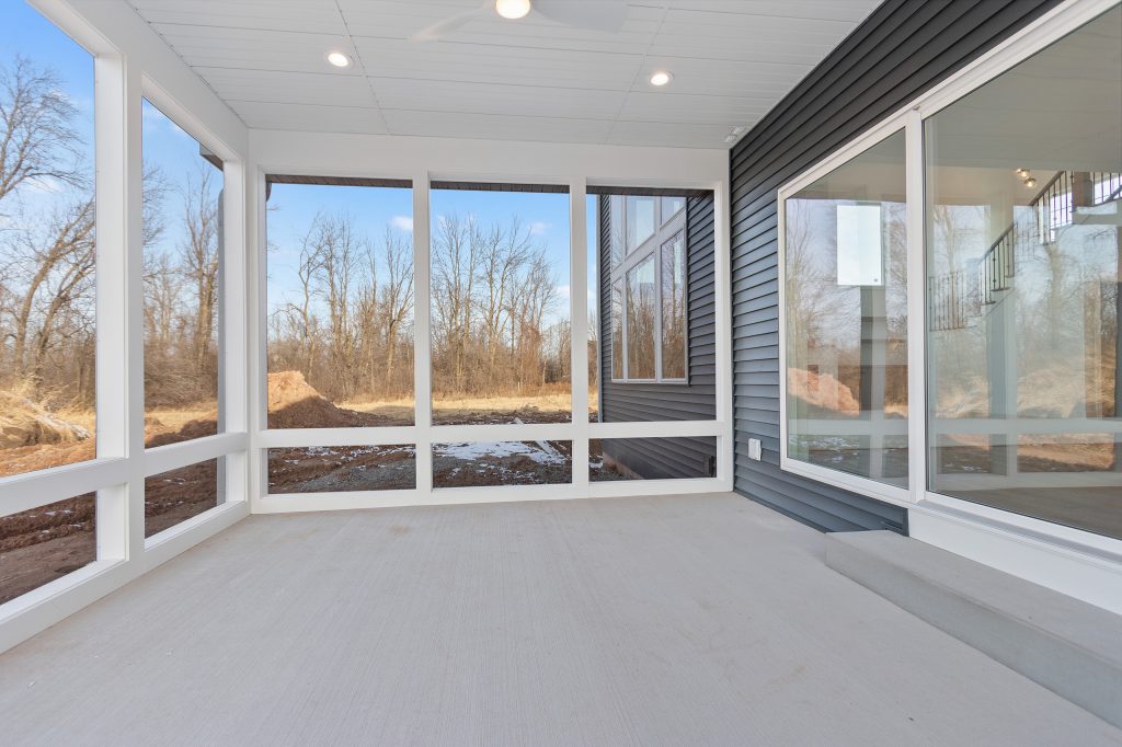 Mid-sized transitional concrete screened-in back porch photo in Other with a roof extension by Excelsior Professional Painting | Outdoor Photos | Porch | Landscaping | Landscape Design | Outdoor Living Space | Porch Design Ideas | Outdoor Living Space Ideas | Backyard Design