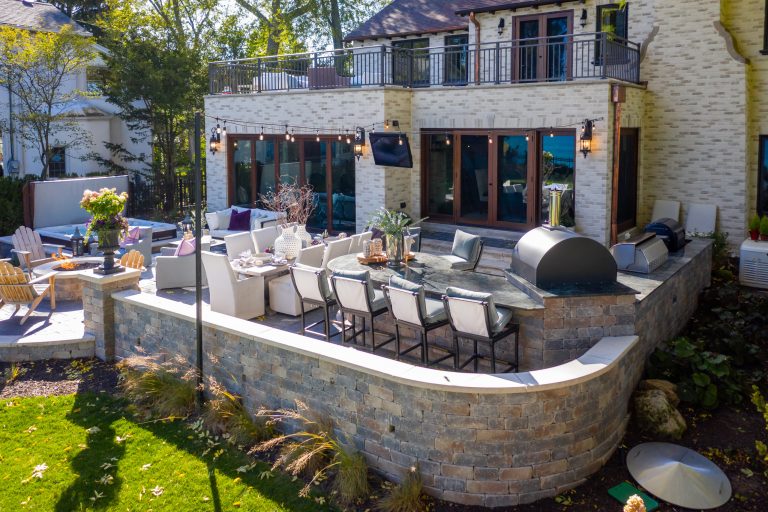 Mid-sized transitional front yard concrete paver patio kitchen photo in Milwaukee with no cover