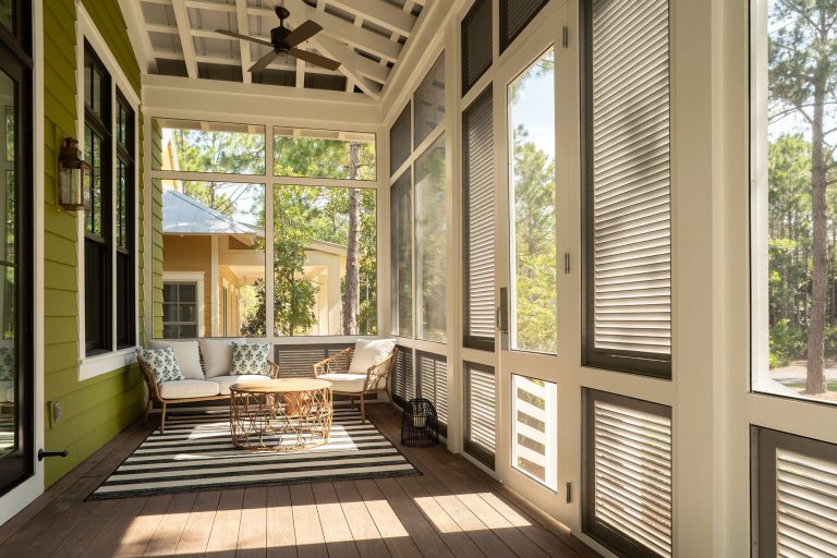 Mid-sized transitional screened-in and wood railing front porch photo in Other with decking and a roof extension by Anthony J. Vallée | Outdoor Photos | Porch | Landscaping | Landscape Design | Outdoor Living Space | Porch Design Ideas | Outdoor Living Space Ideas | Backyard Design