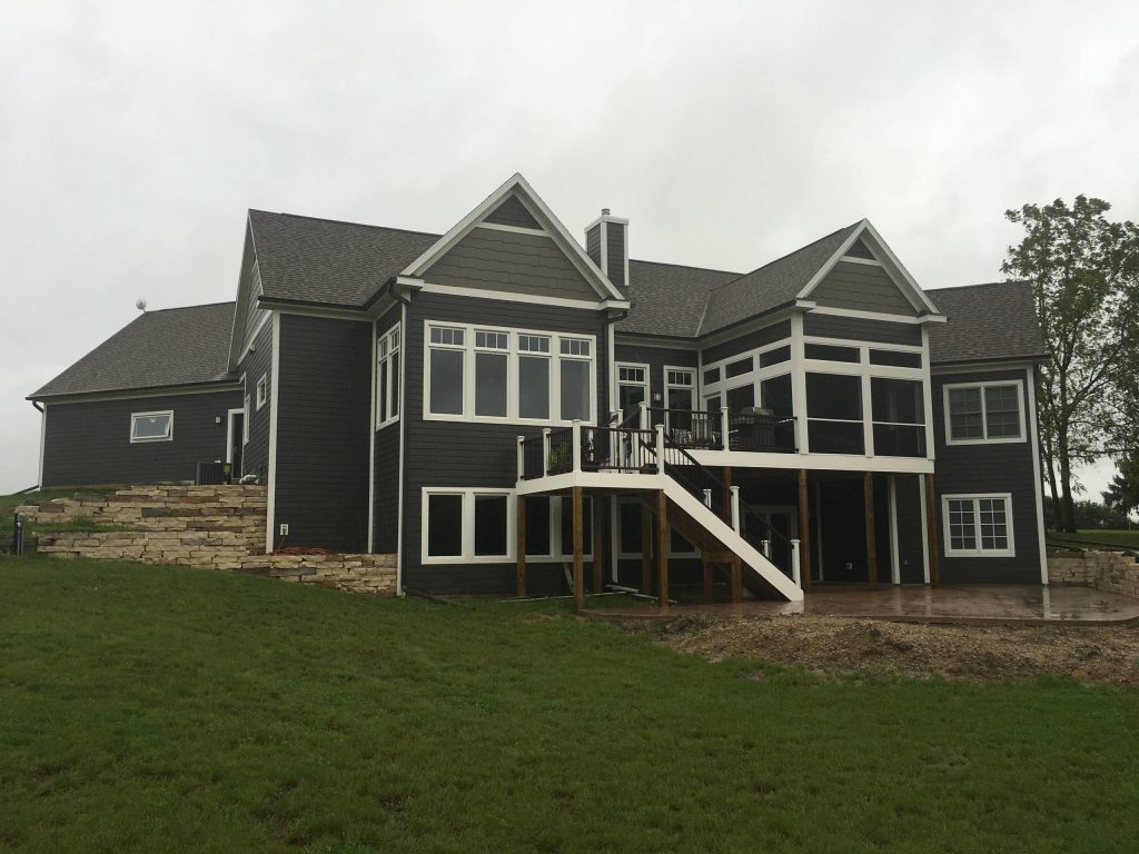 Mid-sized transitional screened-in back porch idea in Other with decking and a roof extension by The Design Connection | Outdoor Photos | Porch | Landscaping | Landscape Design | Outdoor Living Space | Porch Design Ideas | Outdoor Living Space Ideas | Backyard Design