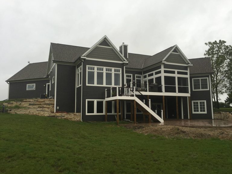 Mid-sized transitional screened-in back porch idea in Other with decking and a roof extension by The Design Connection | Outdoor Photos | Porch | Landscaping | Landscape Design | Outdoor Living Space | Porch Design Ideas | Outdoor Living Space Ideas | Backyard Design