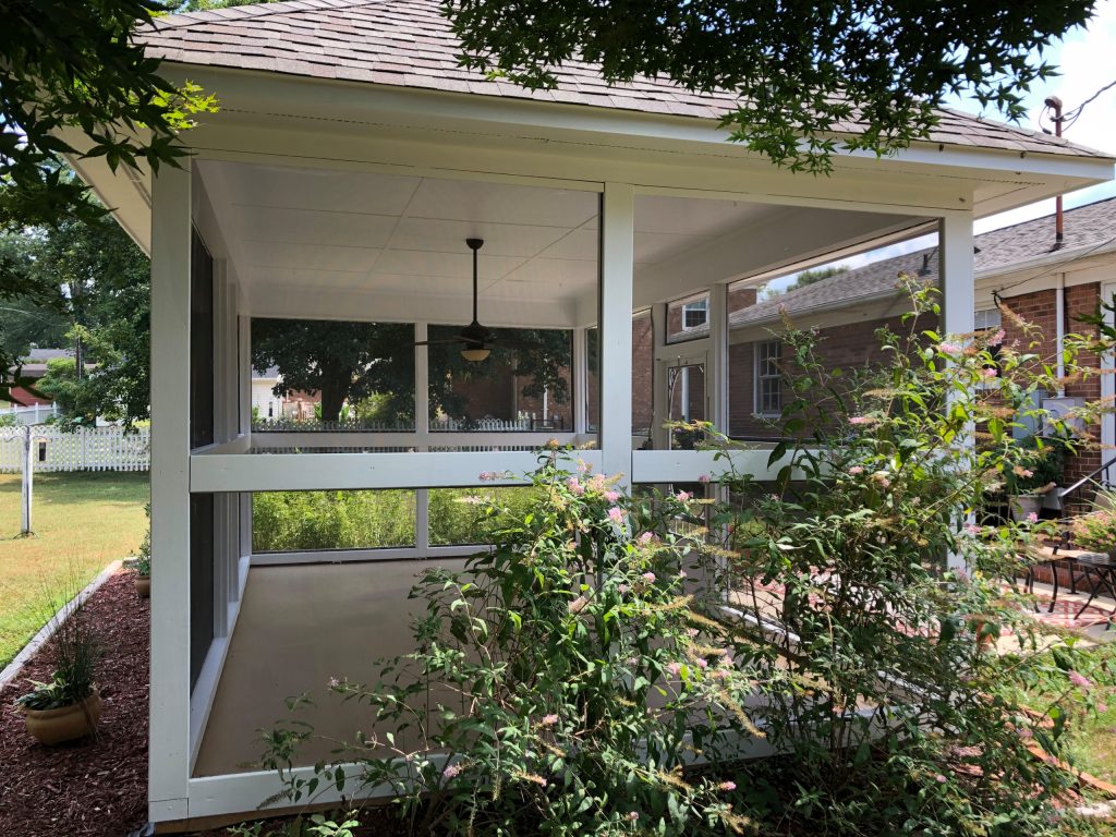 Mid-sized transitional screened-in back porch photo in Other with a roof extension by Excelsior Professional Painting | Outdoor Photos | Porch | Landscaping | Landscape Design | Outdoor Living Space | Porch Design Ideas | Outdoor Living Space Ideas | Backyard Design