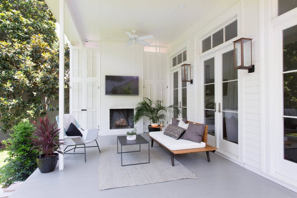 Mid-sized trendy back porch photo in New Orleans with a fire pit, decking and a roof extension by NANO LLC | Outdoor Photos | Porch | Landscaping | Landscape Design | Outdoor Living Space | Porch Design Ideas | Outdoor Living Space Ideas | Backyard Design