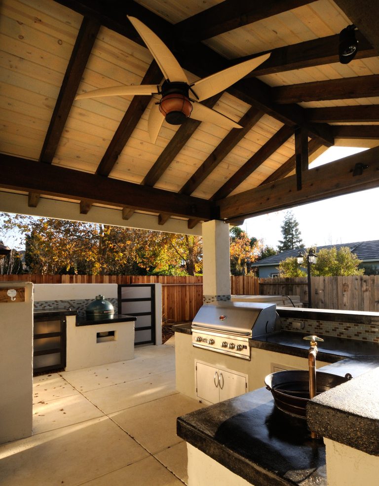 Mid-sized trendy backyard concrete patio kitchen photo in Sacramento with a roof extension