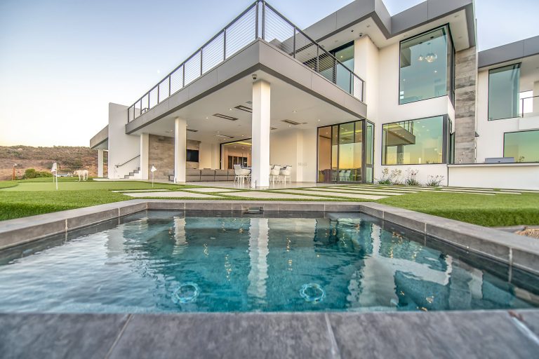 Mid-sized trendy backyard concrete paver hot tub photo in Los Angeles