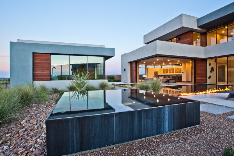 Mid-sized trendy backyard custom-shaped aboveground hot tub photo in Las Vegas
