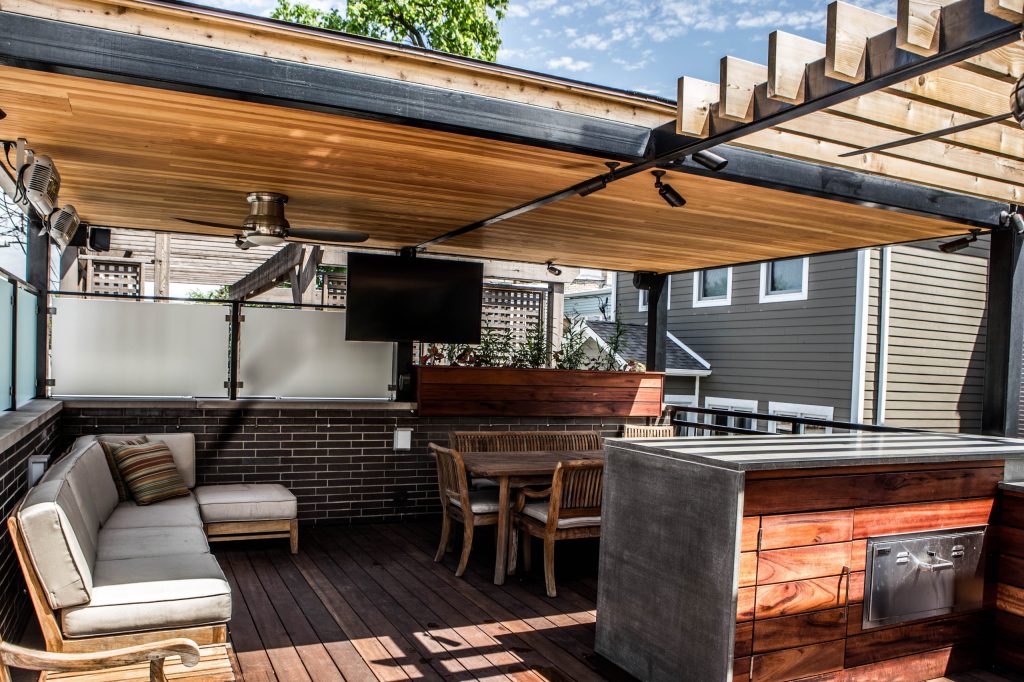 Mid-sized trendy backyard outdoor kitchen deck photo in Orange County with a pergola