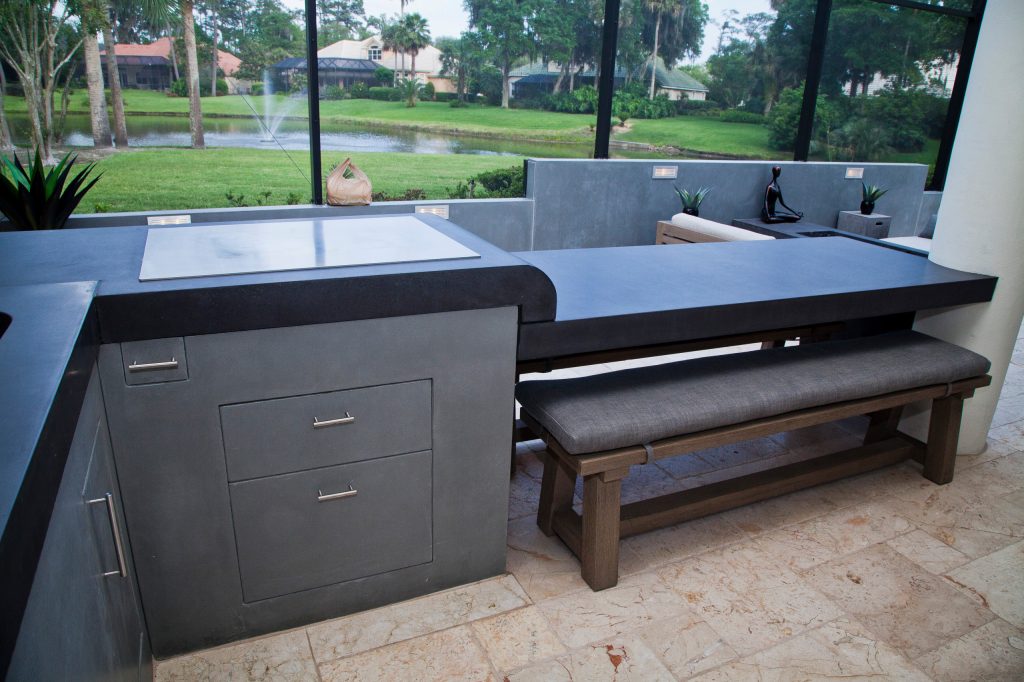 Mid-sized trendy backyard stone patio kitchen photo in Jacksonville