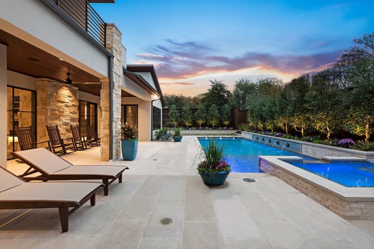 Mid-sized trendy backyard tile and rectangular lap pool fountain photo in Dallas