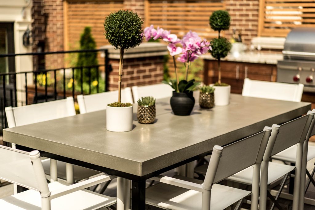 Mid-sized trendy backyard tile patio kitchen photo in Orange County with a pergola