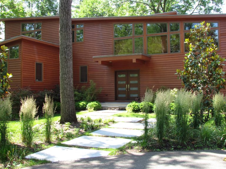 Mid-sized trendy concrete front porch idea in Philadelphia with an awning by Ronni Hock Garden & Landscape | Outdoor Photos | Porch | Landscaping | Landscape Design | Outdoor Living Space | Porch Design Ideas | Outdoor Living Space Ideas | Backyard Design