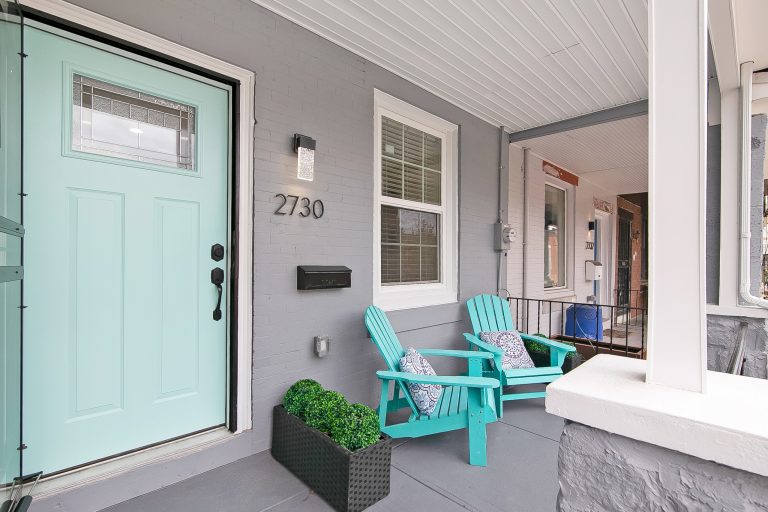 Mid-sized trendy concrete front porch photo in Philadelphia with a roof extension by Kate Grzymala Design | Outdoor Photos | Porch | Landscaping | Landscape Design | Outdoor Living Space | Porch Design Ideas | Outdoor Living Space Ideas | Backyard Design