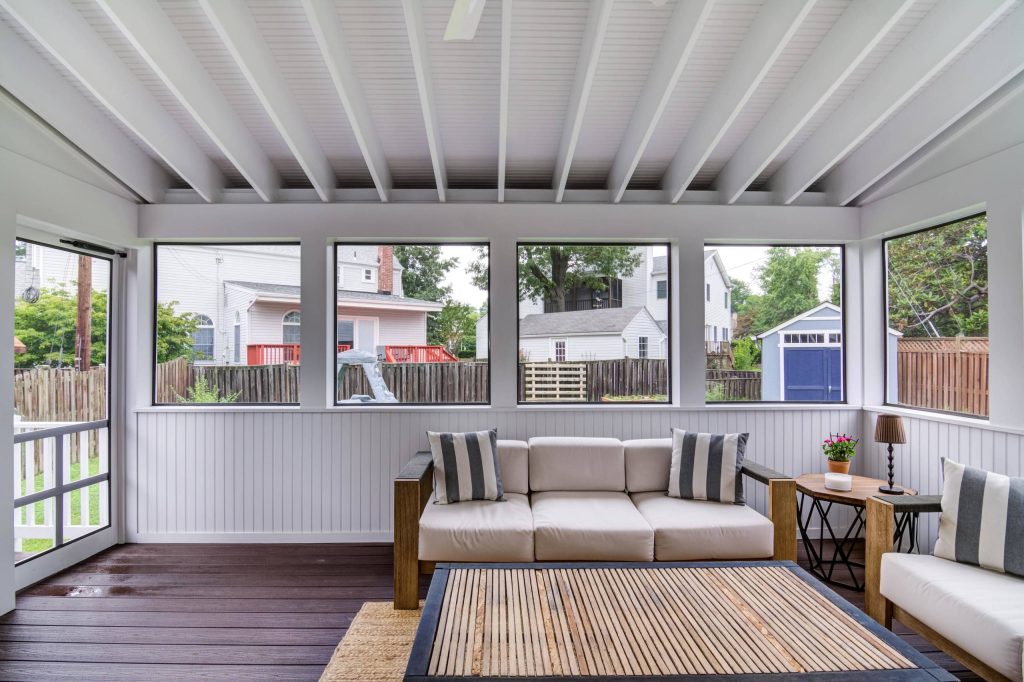 Mid-sized trendy screened-in back porch idea in DC Metro with decking and a roof extension by Atlas Moran Construction | Outdoor Photos | Porch | Landscaping | Landscape Design | Outdoor Living Space | Porch Design Ideas | Outdoor Living Space Ideas | Backyard Design
