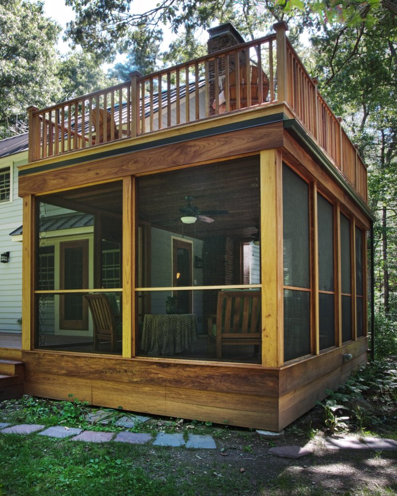 Mid-sized trendy screened-in back porch idea in Other with decking and a roof extension by Oteri Kitchen & Bath Inc. | Outdoor Photos | Porch | Landscaping | Landscape Design | Outdoor Living Space | Porch Design Ideas | Outdoor Living Space Ideas | Backyard Design