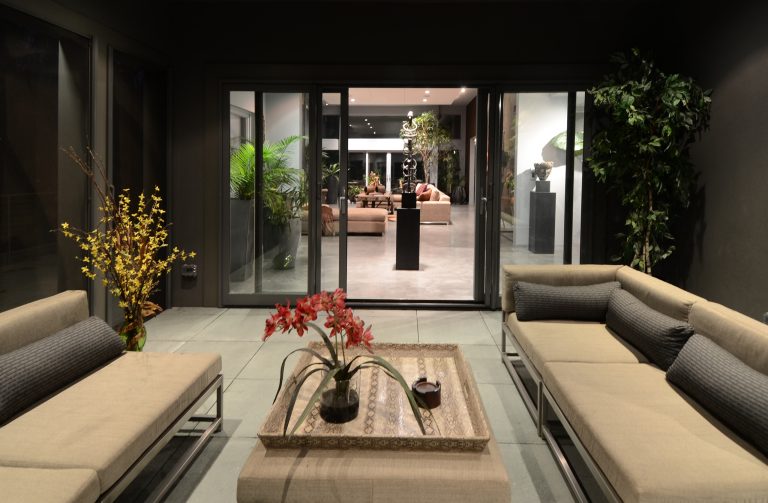 Mid-sized trendy screened-in porch photo in Baltimore with a roof extension by Turner Design Firm | Outdoor Photos | Porch | Landscaping | Landscape Design | Outdoor Living Space | Porch Design Ideas | Outdoor Living Space Ideas | Backyard Design