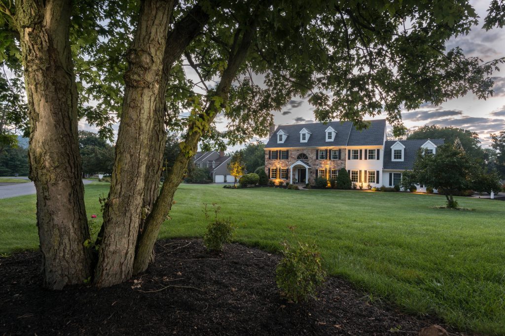 Mid-sized trendy stone front porch idea in Philadelphia with a roof extension by Chestnut Hill Landscape Contractors | Outdoor Photos | Porch | Landscaping | Landscape Design | Outdoor Living Space | Porch Design Ideas | Outdoor Living Space Ideas | Backyard Design