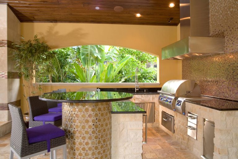 Mid-sized tuscan backyard tile patio kitchen photo in Los Angeles with a roof extension