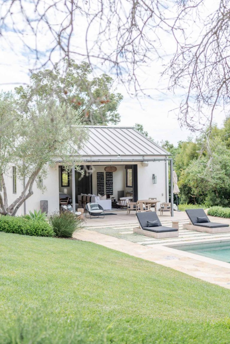 Minimalist backyard stone and rectangular pool house photo in Santa Barbara