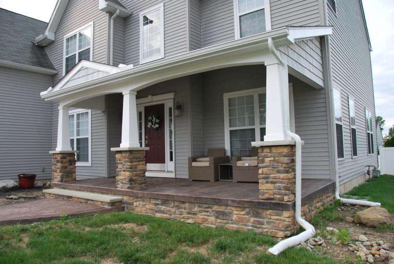 Minimalist brick front porch idea in Cleveland with a roof extension by DeckCreator | Outdoor Photos | Porch | Landscaping | Landscape Design | Outdoor Living Space | Porch Design Ideas | Outdoor Living Space Ideas | Backyard Design